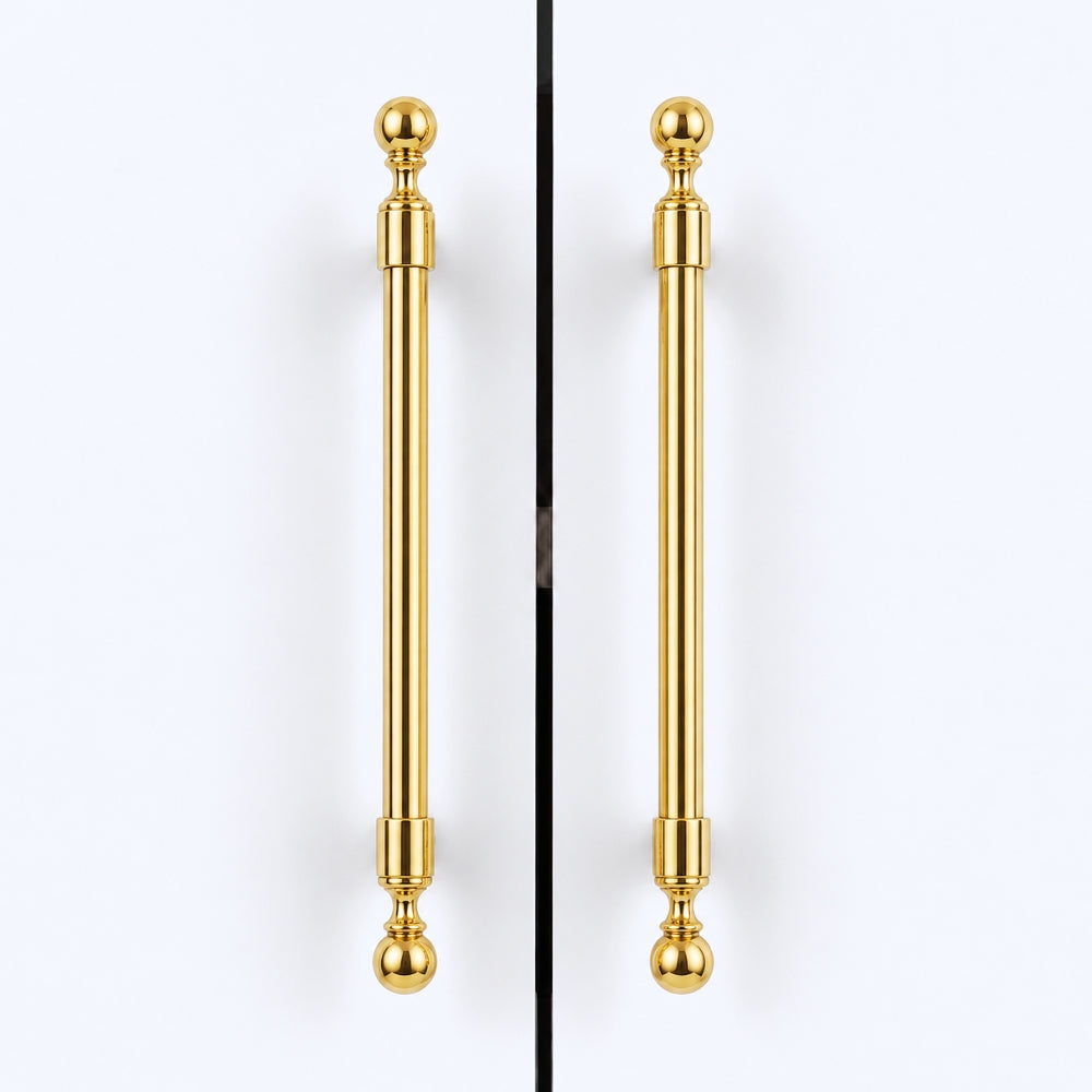 Two matching polished gold cabinet handles with spherical finials, shown vertically side by side against a clean white background.