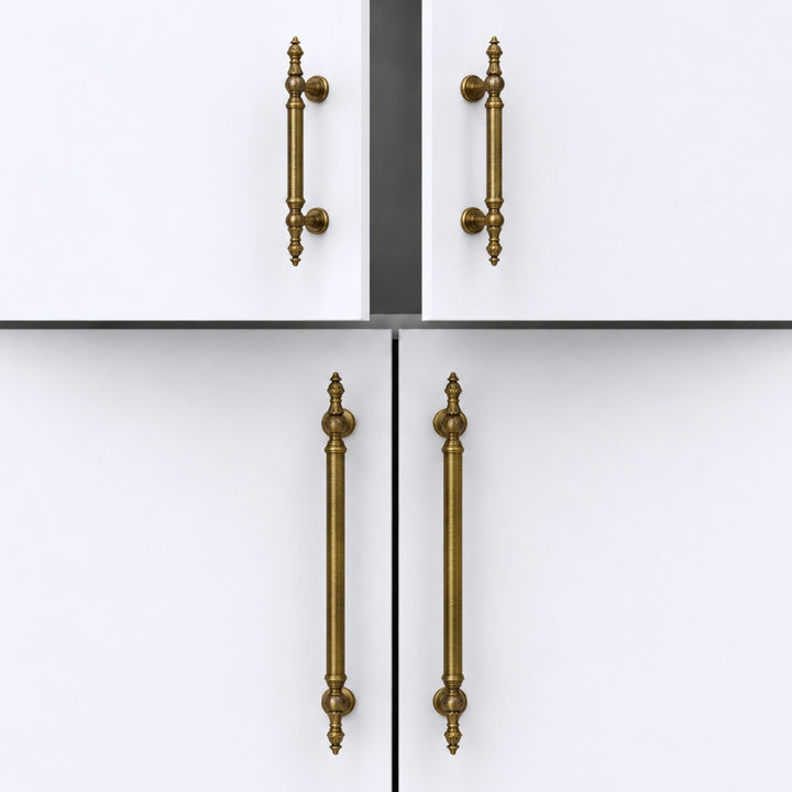 Four cabinet handles in a distressed brass or bronze finish, shown on white doors in a clean studio-style product presentation.