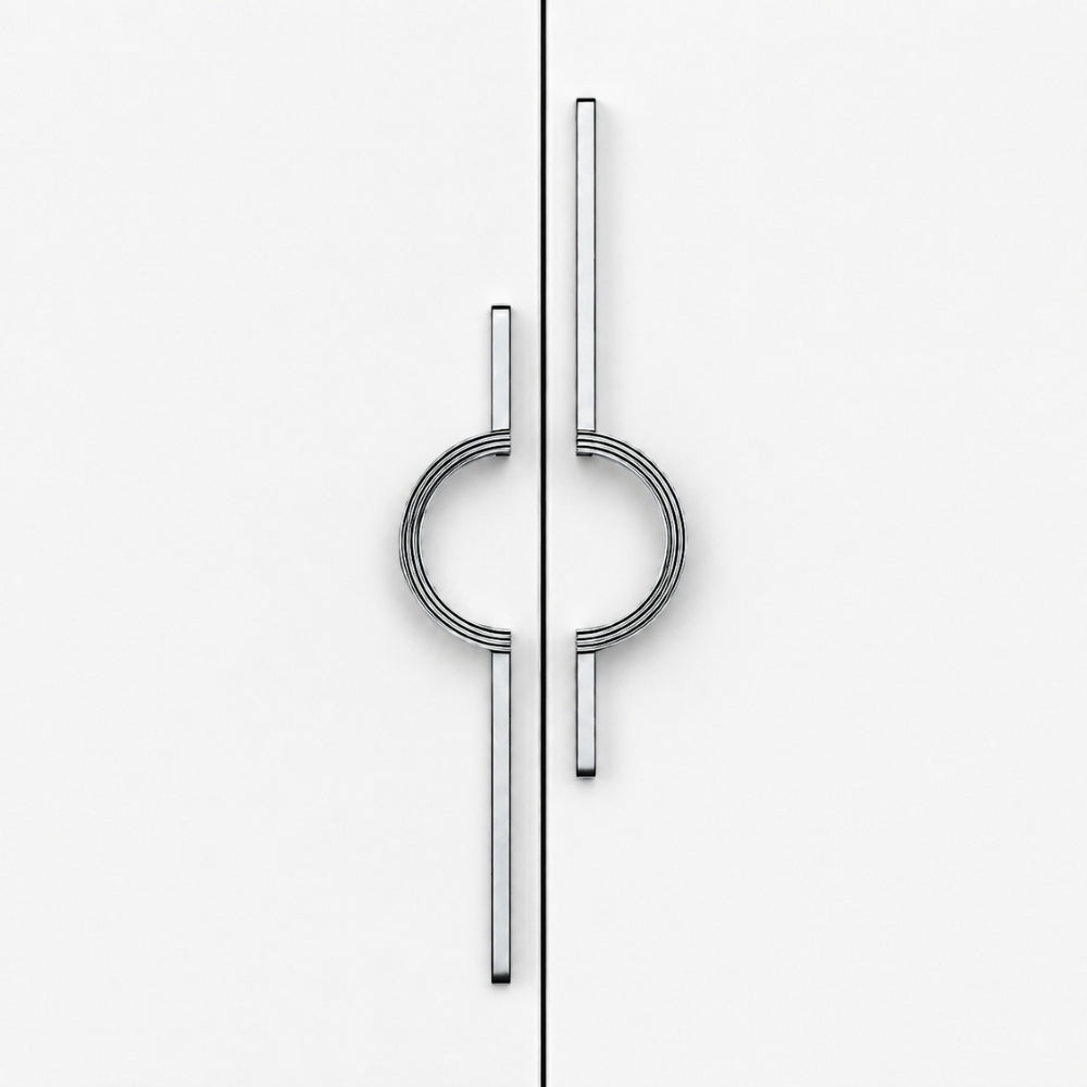 A pair of modern, minimalist cabinet pulls with a polished silver finish, featuring a circular ring design integrated with two vertical bars, shown on a clean white door split by a vertical seam.