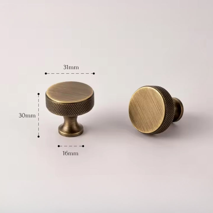 Matching antique brass cabinet knob from the GLEAM set