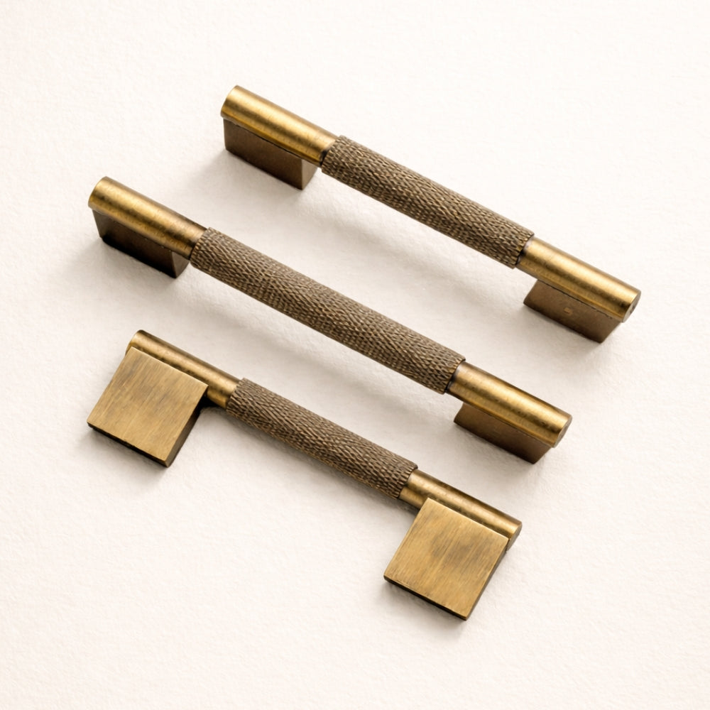 Side profile of antique brass 5-inch cabinet pull showing projection