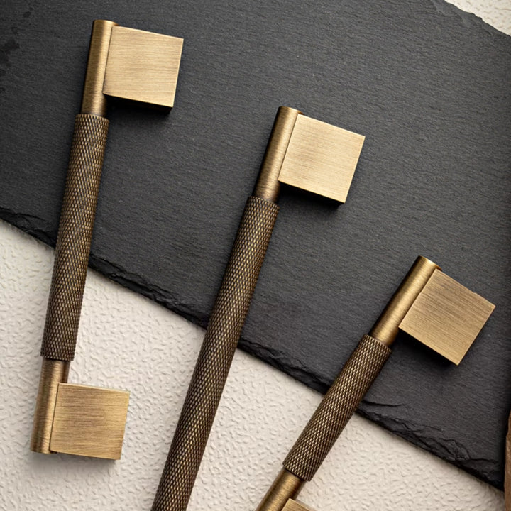 Antique brass 5-inch pull against stone benchtop