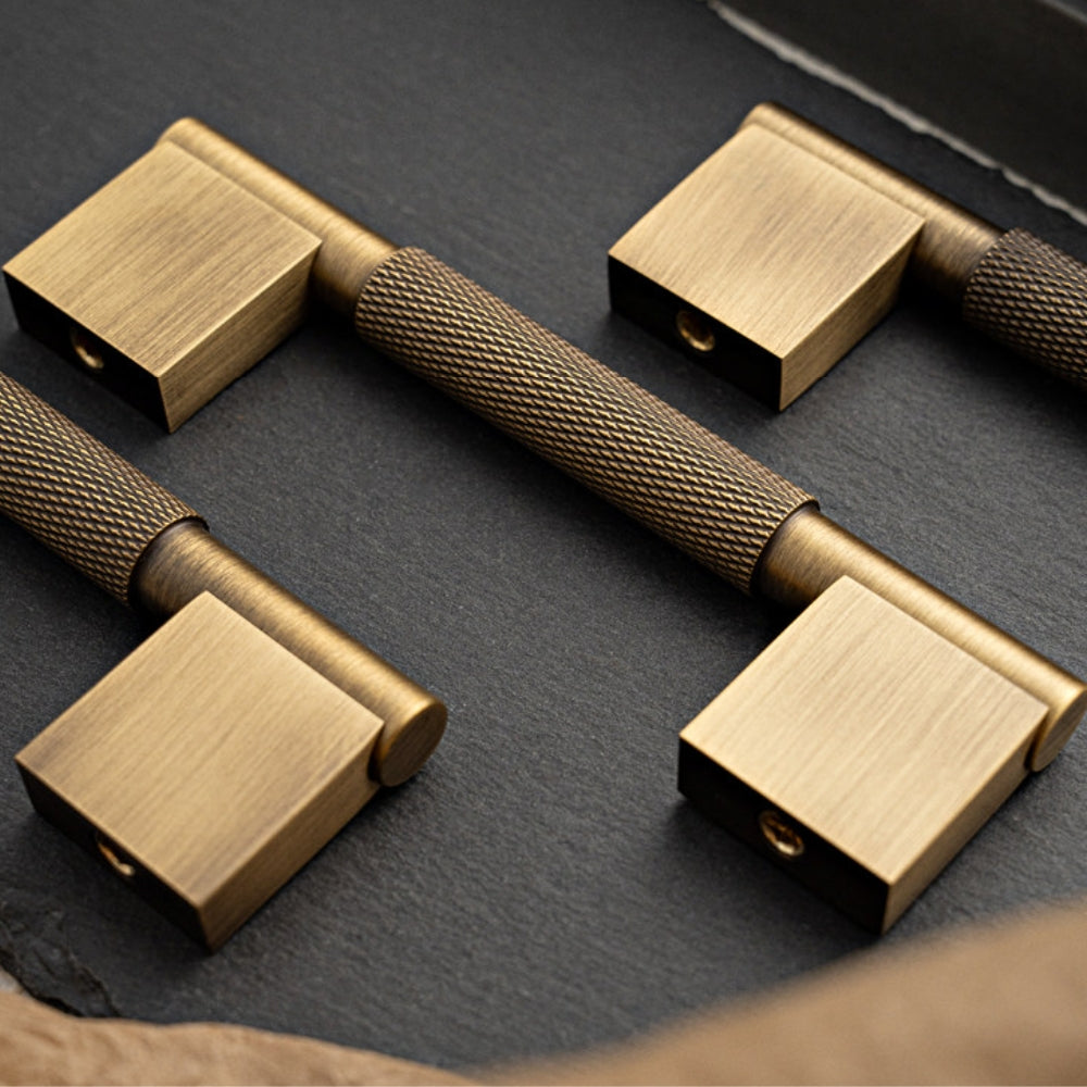 Antique brass 5-inch pull styled on tabletop