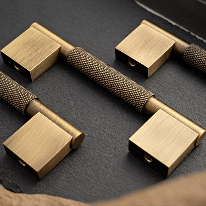 Antique brass 5-inch pull styled on tabletop
