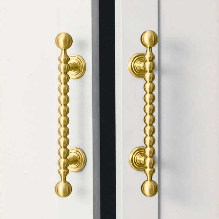 AURA brushed brass 3.75-inch cabinet knobs and pulls by ARCHANDLES