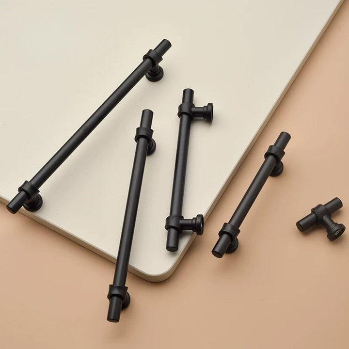 SKYE matte black pull at 10-inch scale on large white Shaker cabinet fronts